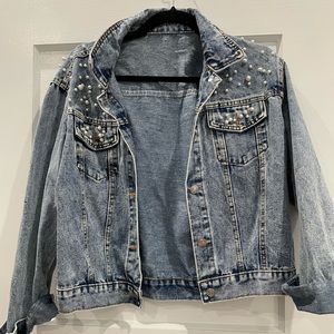 Oversized denim jacket with pearl embroidery.